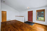 Step into this inviting entryway featuring gleaming hardwood floors that extend throughout the space.