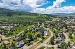 Discover this stunning mountain town home, nestled amidst lush greenery and offering breathtaking panoramic views.