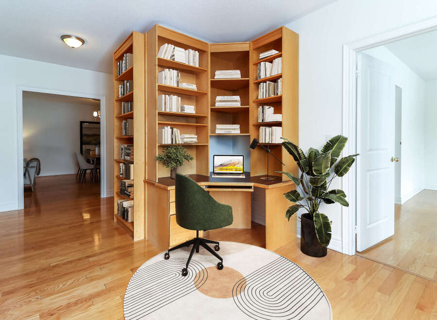 This stunning property features a custom-built home office with a built-in desk and shelving, perfect for remote work or study.