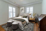 This stunning bedroom offers a serene retreat with its elegant design and inviting ambiance.