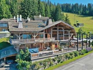 Discover the charm of this stunning wooden chalet, a perfect blend of rustic elegance and modern comfort.