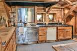 Step into the heart of this rustic kitchen, where charm meets functionality.