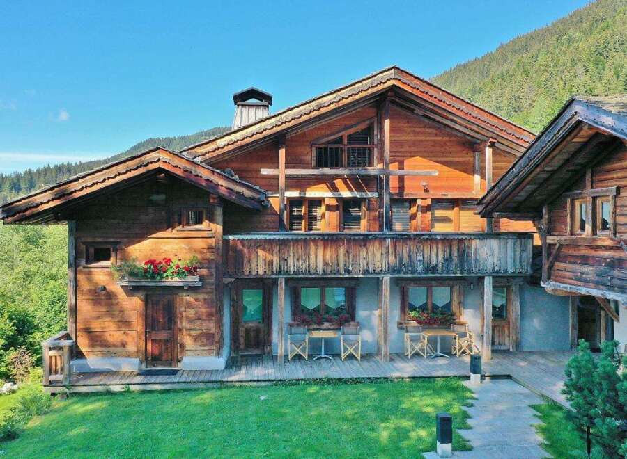 This stunning wooden chalet offers a perfect blend of rustic charm and modern comfort.