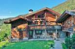 This stunning wooden chalet offers a perfect blend of rustic charm and modern comfort.