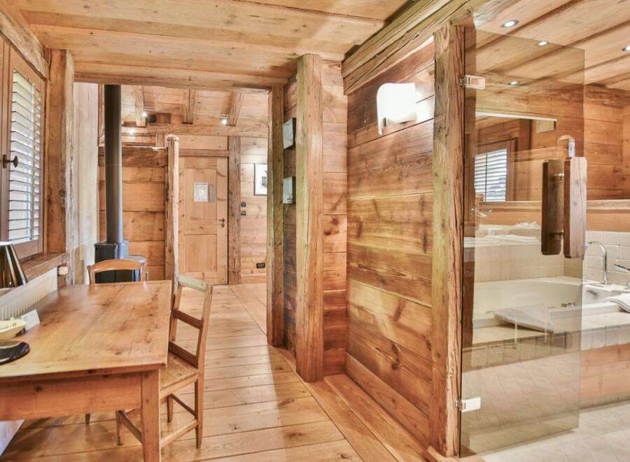 Step into rustic elegance with this stunning property featuring exquisite wooden interiors.