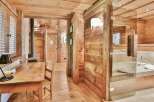 Step into rustic elegance with this stunning property featuring exquisite wooden interiors.