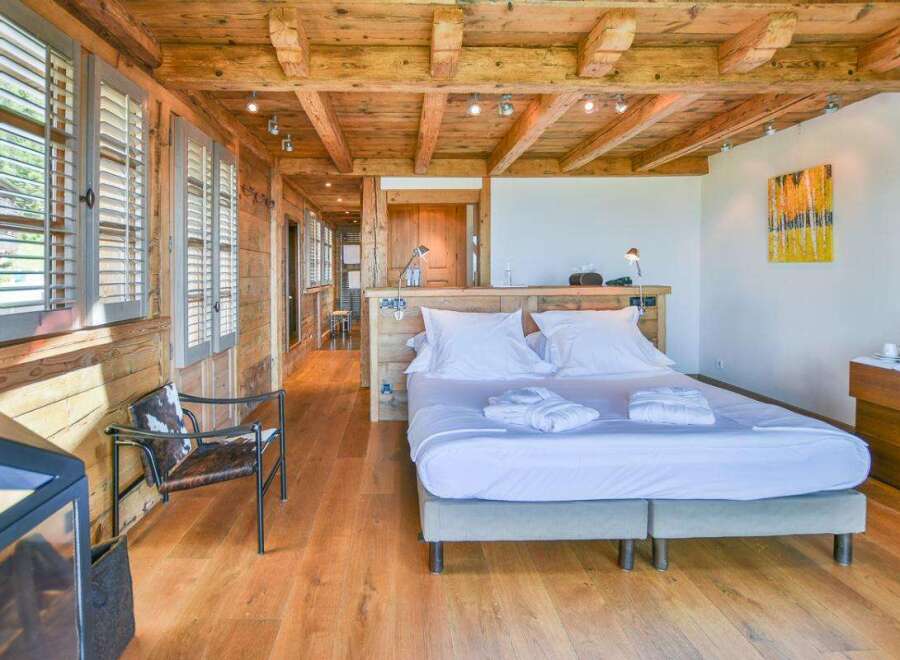 Experience rustic elegance in this stunning bedroom.