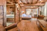 Experience rustic elegance in this stunning property, featuring exquisite wooden details throughout.