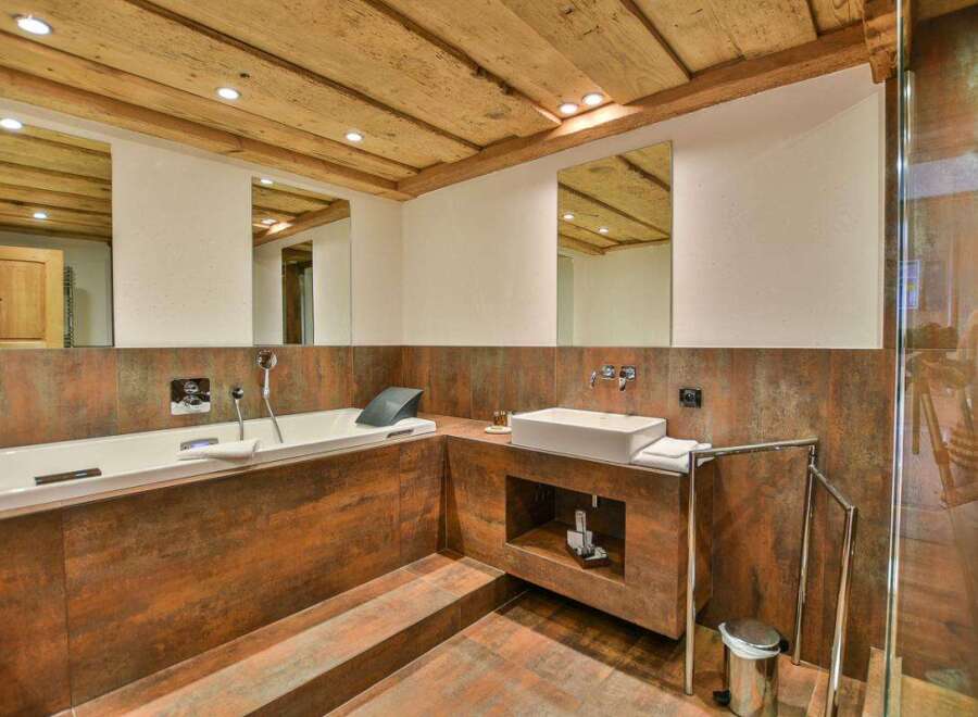 Experience luxury in this stunning bathroom featuring a sleek, modern design.