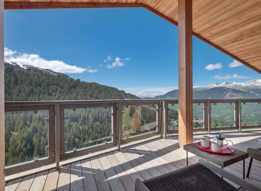 Experience breathtaking mountain views from this stunning balcony, perfect for enjoying your morning coffee or evening relaxation.