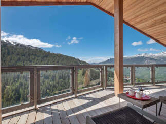 Experience breathtaking mountain views from this stunning balcony, perfect for enjoying your morning coffee or evening relaxation.