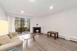 This stunning property boasts a cozy living room with a fireplace, perfect for those chilly evenings.
