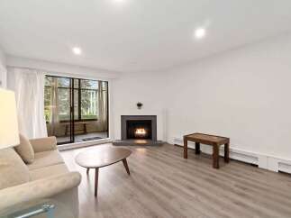 This stunning property boasts a cozy living room with a fireplace, perfect for those chilly evenings.