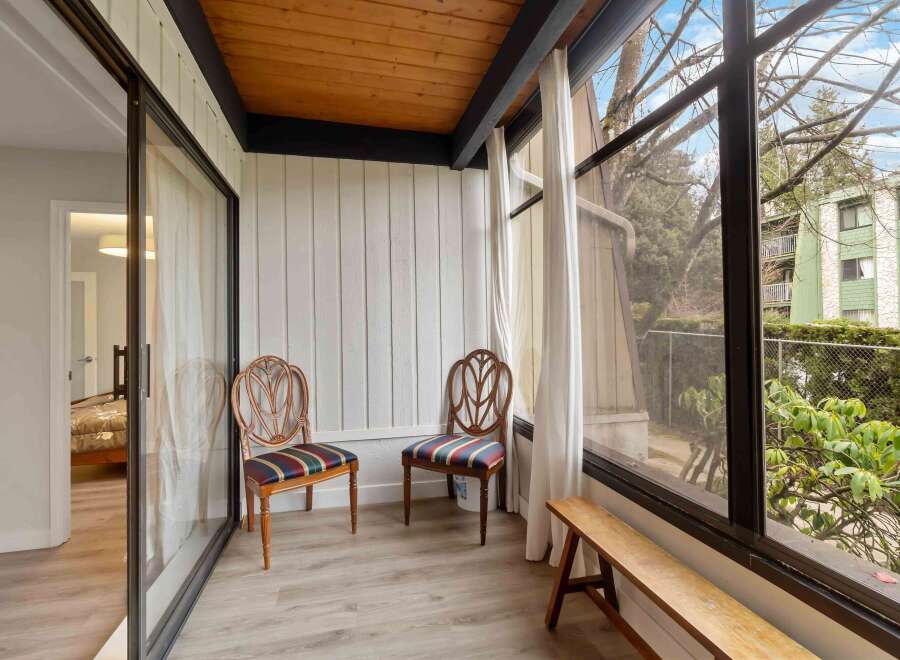 Step into this inviting sunroom, perfect for relaxation and enjoying the outdoors.