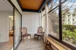 Step into this inviting sunroom, perfect for relaxation and enjoying the outdoors.
