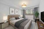 Step into this inviting bedroom, featuring a cozy bed adorned with stylish bedding and pillows.