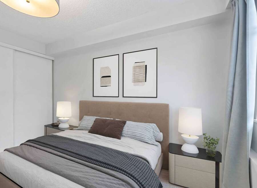 This inviting bedroom features a cozy bed with stylish bedding, perfect for relaxation.