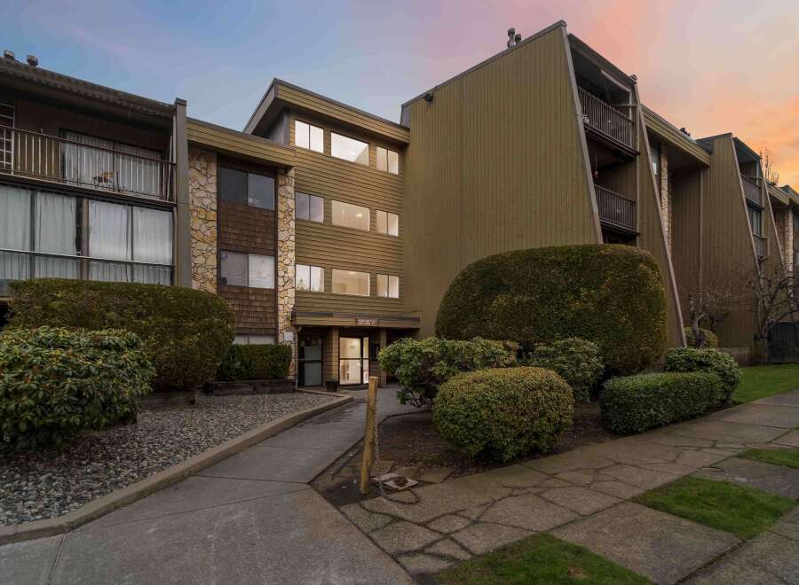 Discover a charming condo building with a unique architectural design.