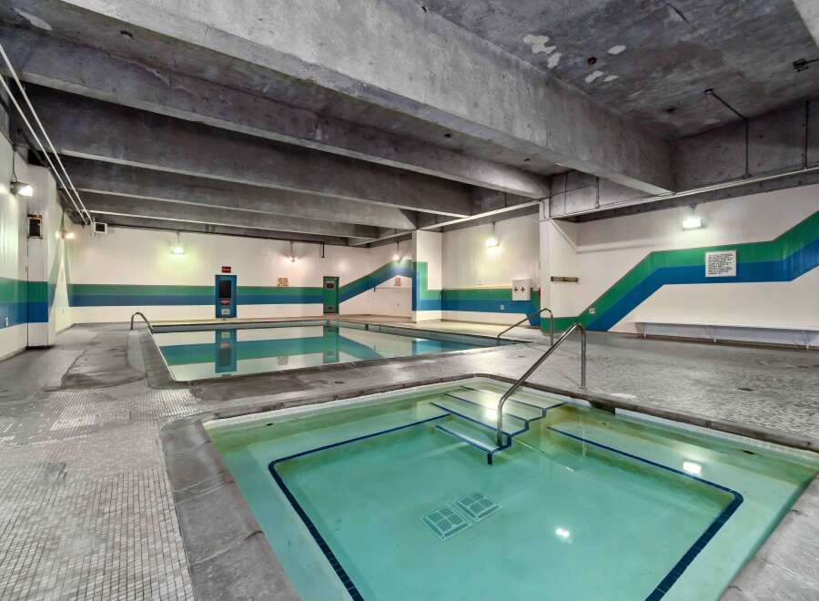 Enjoy a relaxing swim in this indoor pool! This property features a spacious pool area with a hot tub, perfect for unwinding after a long day.