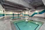 Enjoy a relaxing swim in this indoor pool! This property features a spacious pool area with a hot tub, perfect for unwinding after a long day.