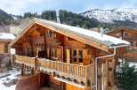 Discover the charm of this stunning wooden chalet nestled in a picturesque mountain setting.
