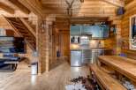 Step into this stunning log cabin, a perfect blend of rustic charm and modern convenience.