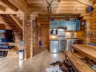 Step into this stunning log cabin, a perfect blend of rustic charm and modern convenience.