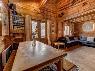 Step into a cozy mountain retreat with this stunning cabin.