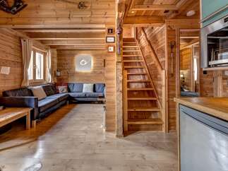 Step into this stunning wooden cabin, a perfect blend of rustic charm and modern comfort.