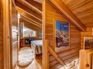 Step into a cozy and inviting space with this charming wooden interior.