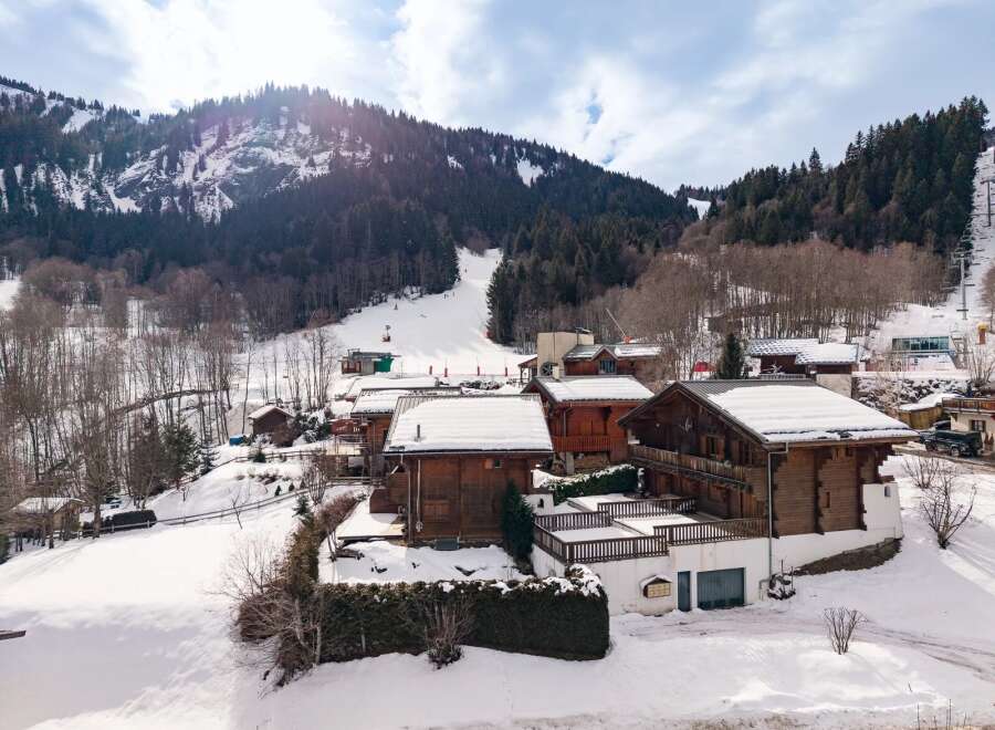 Nestled in a picturesque winter wonderland, this charming property offers a cozy retreat with stunning mountain views.