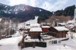 Nestled in a picturesque winter wonderland, this charming property offers a cozy retreat with stunning mountain views.