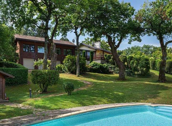 Discover your dream home with this stunning property! This beautiful house boasts a private pool, lush green lawns, and mature trees, creating a serene and inviting atmosphere.