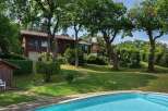 Discover your dream home with this stunning property! This beautiful house boasts a private pool, lush green lawns, and mature trees, creating a serene and inviting atmosphere.
