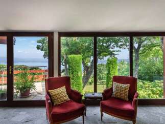 Enjoy breathtaking views from this stunning property! This home features large windows that offer panoramic views of the surrounding landscape.