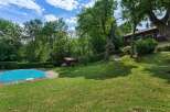 Discover your dream home in this stunning property! Featuring a private pool, lush green lawns, and mature trees, this residence offers a serene and picturesque setting.