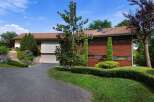 Discover this stunning property featuring a modern design and lush landscaping.