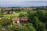 Nestled amidst lush greenery, this stunning property offers breathtaking views of the surrounding landscape.