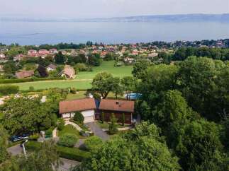 Nestled amidst lush greenery, this stunning property offers breathtaking views of the surrounding landscape.