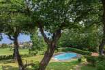 Escape to your own private oasis with this stunning property! Featuring a beautiful pool surrounded by lush greenery, this home offers the perfect blend of luxury and tranquility.