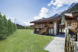 Experience the epitome of alpine luxury in this stunning wooden chalet.