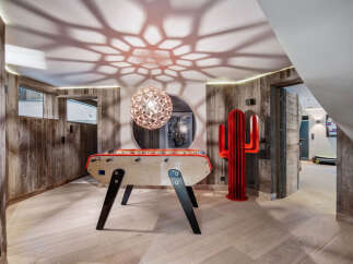 This stunning property boasts a unique game room, perfect for entertaining and relaxation.