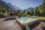 Escape to your own private oasis with this stunning property! Enjoy breathtaking mountain views from the comfort of your hot tub, perfect for relaxation and unwinding.