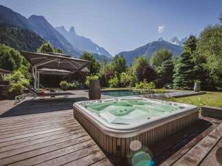 Escape to your own private oasis with this stunning property! Enjoy breathtaking mountain views from the comfort of your hot tub, perfect for relaxation and unwinding.