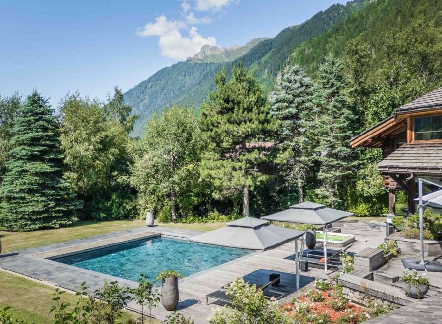 Escape to your own private oasis with this stunning property! Featuring a luxurious pool, expansive wooden deck, and breathtaking mountain views, this home offers the ultimate in relaxation and privacy.