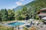 Escape to your own private oasis with this stunning property! Featuring a luxurious pool, expansive wooden deck, and breathtaking mountain views, this home offers the ultimate in relaxation and privacy.