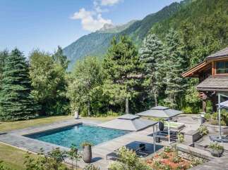Escape to your own private oasis with this stunning property! Featuring a luxurious pool, expansive wooden deck, and breathtaking mountain views, this home offers the ultimate in relaxation and privacy.