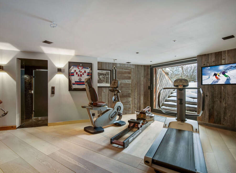 This luxurious home gym offers a perfect blend of fitness and relaxation.