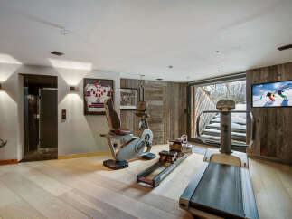 This luxurious home gym offers a perfect blend of fitness and relaxation.