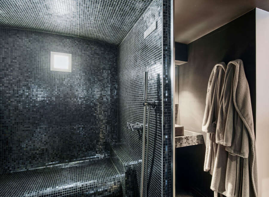 Step into luxury with this stunning bathroom featuring a sleek, modern design.
